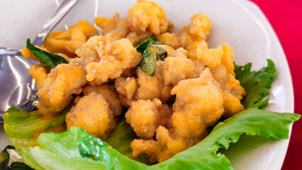 Asian Seafood Dishes: Deep Fried Squid or Calamari on the plate. 