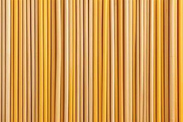 Obraz premium a close up of a bunch of yellow pencils on a table