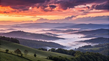 Obraz premium Sunrise over Misty Mountains Landscape Photography, Wide Composition, Serene Atmosphere, Colorful Sky, Rolling Hills Landscape Photography, Sunrise