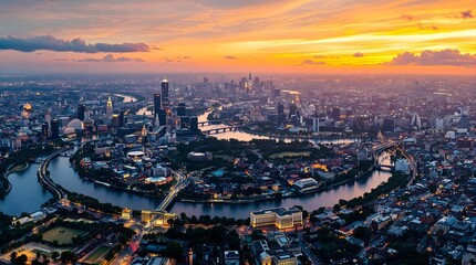 Obraz premium Aerial view of a city with river at twilight