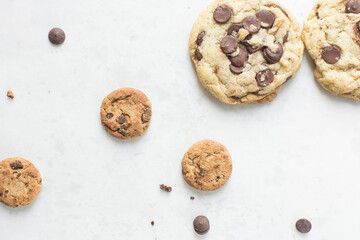 Overhead view of chocolate chip cookies on a white background, top view of homemade chocolate chip cookies