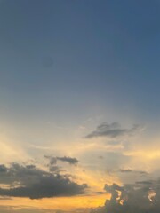 Beautiful sky with natural gradations. Thick clouds in the dusk sky on a winter night. Image of a cloudy sky in the afternoon. View of the night sky with golden light from the evening sun