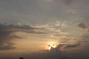 Beautiful sky with natural gradations. Thick clouds in the dusk sky on a winter night. Image of a cloudy sky in the afternoon. View of the night sky with golden light from the evening sun