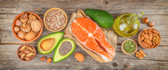 Foods high in fatty acids including vegetables, seafood, nut and seeds. Healthy fats, clean eating for weight loss. top view