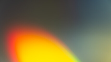 Abstract blurred background, yellow red spot on gray gradient background.