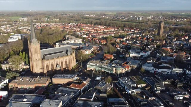Raalte, the Netherlands - January 10th 2025: Aerial footage of the town center. Drone flying backwards whilst slowly ascending to high altitude.