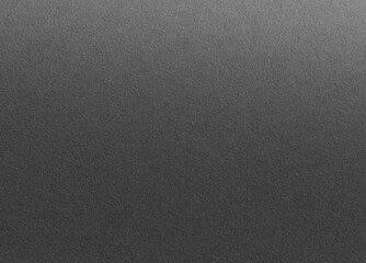 Charcoal gray paper background with a gradient matte texture and subtle grainy details. Dark neutral tones create a refined, stylish, and sophisticated design with a seamless, modern composition.