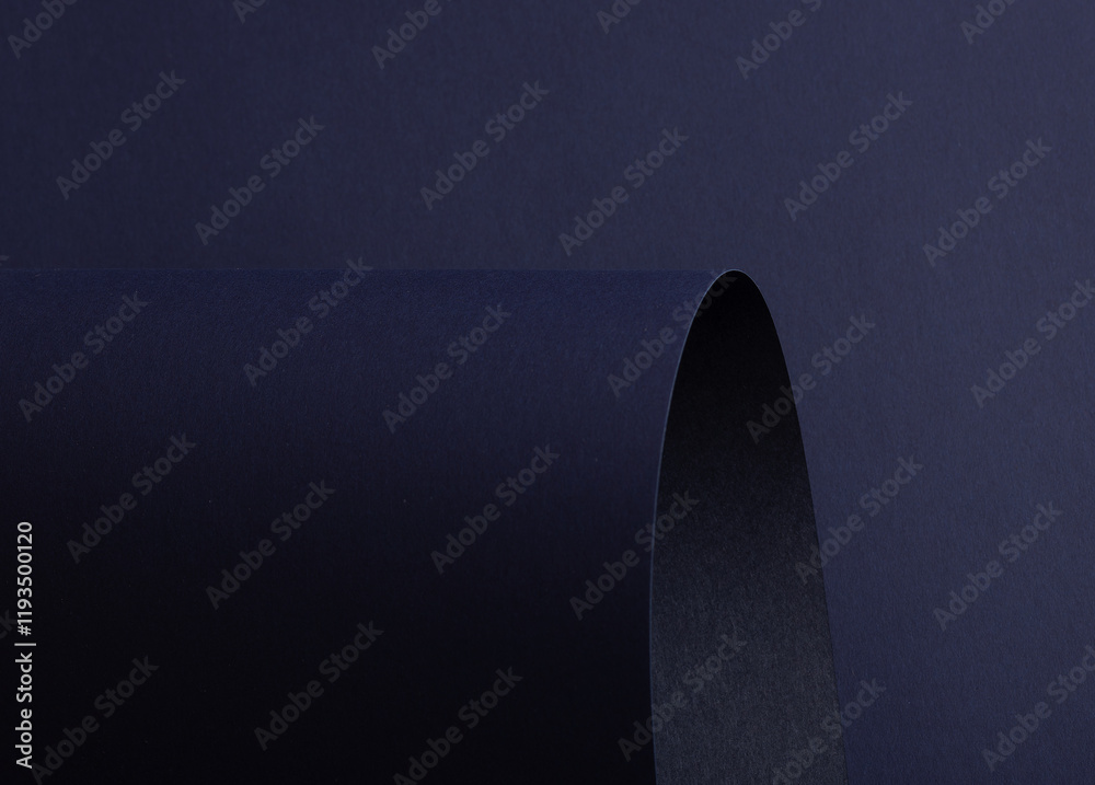 Poster midnight blue paper background with curved, matte surfaces and a smooth, grainy texture. dark bold t