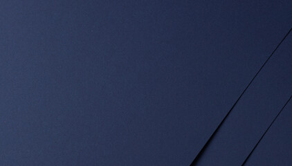 Midnight blue paper background with smooth, matte textures and overlapping layers. Bold dark tones...