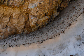 Melting snow in boulders shadow, Yellowstone National Park.
