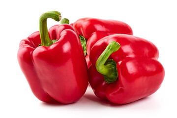 Red ripe bell peppers, isolated on white background.