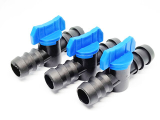 Agricultural pipes isolated over white background.Drip irrigation plastic pipes with valves that are isolated over white background.Connector pipes used to connect hoses in drip irrigation.