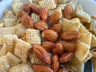 Rice Checked Breakfast Cereal Topped With Whole Almonds And Honey