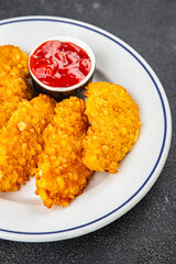 Chicken nuggets in breaded deep fried fresh tasty food dish delicious gourmet food background on the table rustic food top view copy space