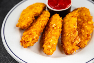 Chicken nuggets in breaded deep fried fresh tasty food dish delicious gourmet food background on the table rustic food top view copy space