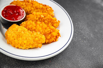 Chicken nuggets in breaded deep fried fresh tasty food dish delicious gourmet food background on the table rustic food top view copy space