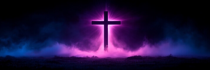 Cross glowing with purple and blue light surrounded by mist, concept of Easter spirituality and faith