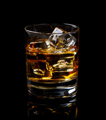 A refined glass of whiskey on the rocks