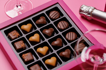 A glasses of champagne elegantly paired with a gift box