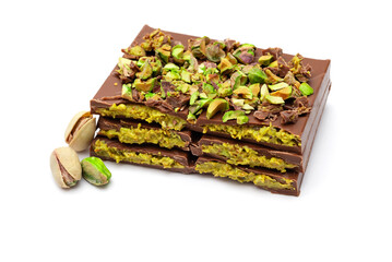 Dubai chocolate with pistachio paste and pistachios on white background