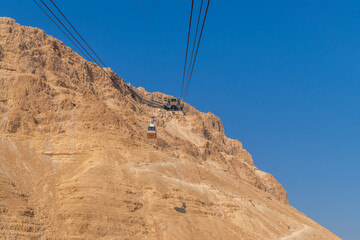 Empty cable car descending to Masada National Park in Israel.
