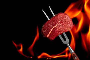 beef steak grill with fire flames. Barbecue and grill concept on a black background. copy space