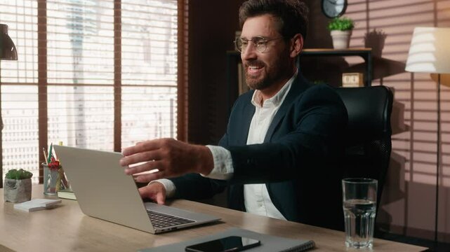 Successful smiling Caucasian middle-aged business man businessman guy male employer in office at table finish online working end computer job complete laptop task done relaxing hands behind head pause