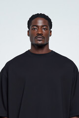 Obraz premium Male fashion concept. Portrait of a handsome afro-american male model wearing black designer clothes and posing on white background. Catalogue, campaign style. Studio shot