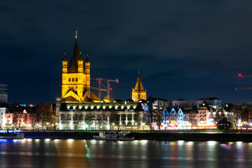 Cologne. Germany. 08.10.24. Night view of the River Rhine and the Great Saint Martin Church in Cologne (Koln), Germany.