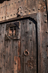 Vintage door with trim ornaments and wrought iron details