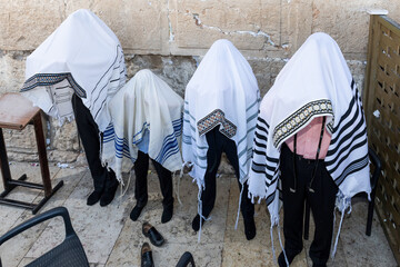 Cohanim or Jewish priests cover their heads with their prayer shawls and recite a special blessing for God's protection of  the Jewish people.