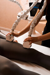 Correcting the shape of the body by lymphatic drainage in the beauty salon. Correcting the shape of man's the legs by lymphatic massage. Calf massage for relax and strong.