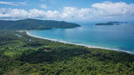 Beautiful aerial view of a preserved area, Fazenda Beach, within the Serra do Mar State Park, a destination for sustainable and ecological tourism in Atlantic Rainforest, between Montains and Sea.