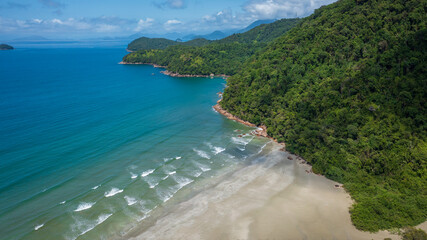 Beautiful aerial view of a preserved area, Fazenda Beach, within the Serra do Mar State Park, a destination for sustainable and ecological tourism in Atlantic Rainforest, between Montains and Sea.