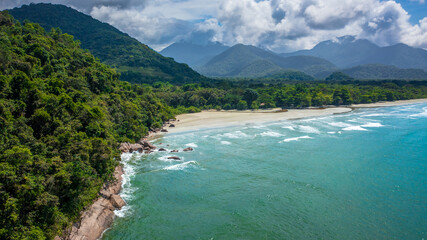 Beautiful aerial view of a preserved area, Fazenda Beach, within the Serra do Mar State Park, a destination for sustainable and ecological tourism in Atlantic Rainforest, between Montains and Sea.