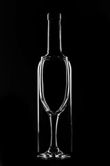 Bottle and glass on a dark background, light contours