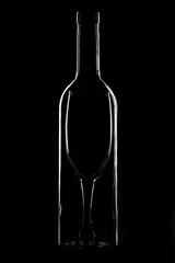 Bottle and glass on a dark background, light contours