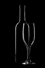 Bottle and glass on a dark background, light contours
