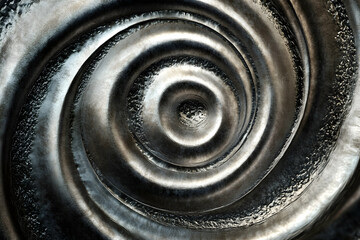 Obraz premium Dynamic spiral of brushed metallic texture showcasing elegance and movement
