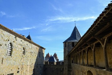 Fototapeta premium Historic castle courtyard under a clear blue sky
