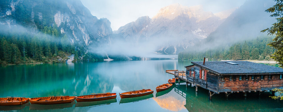 Lago di Braies or Pragser Wildsee lake with boats and fishing dock.Fanes-Sennes-Braies national park in Dolomiti Alps, South Tyrol, Italy