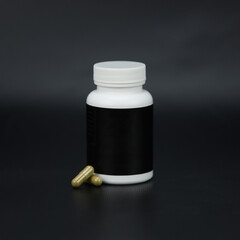 Mockup bottle with natural capsule pills or vitamins, black background. White bottle with healthy supplement