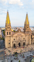 Naklejka premium Aerial view of guadalajara cathedral at sunset with tourists visiting the square. Jalisco, Mexico