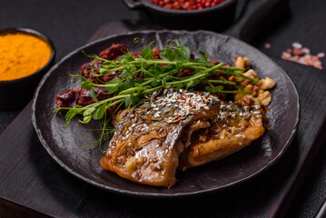 Grilled mackerel fillet pieces with vegetables, salt and spices