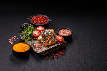 Grilled mackerel fillet pieces with vegetables, salt and spices