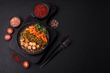 Quinoa bowl with tofu, steamed vegetables, grains, seeds and spices