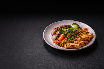 Quinoa bowl with tofu, steamed vegetables, grains, seeds and spices