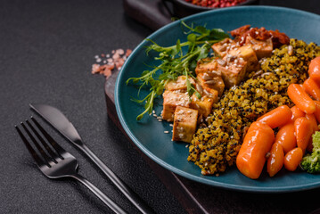 Quinoa bowl with tofu, steamed vegetables, grains, seeds and spices