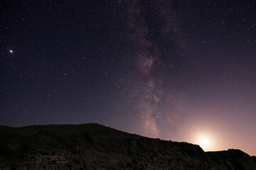 Beautiful night landscape, Bright Milky Way galaxy over the mountains, starry sky.