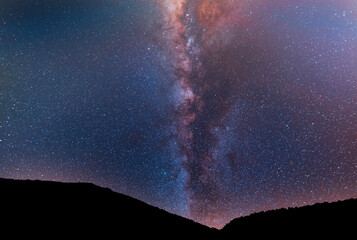 Beautiful night landscape, Bright Milky Way galaxy over the mountains, starry sky.